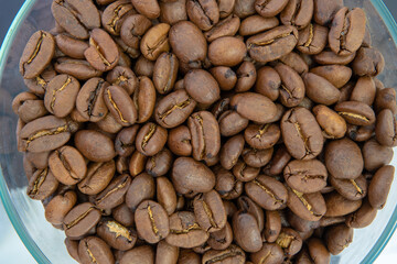 Macro coffee beans background. Close up photographed coffee beans, coffee beans wallpaper