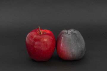 Red apples on a black background. Apple white black red