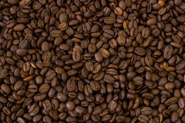 Macro coffee beans background. Close up photographed coffee beans, coffee beans wallpaper