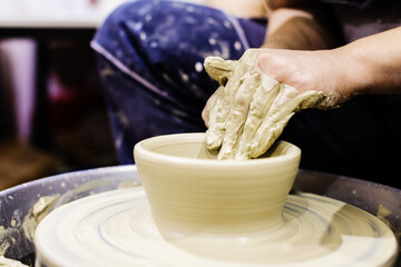 Woman Pottery Artist. Molding Clay On Pottery Wheel At Art Workshop . Ceramic Studio. Closeup View. Female Hands Shapes Clay.	
