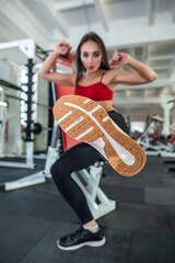 Fototapeta na wymiar young woman having a rest after exercise workout in gym
