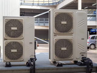 Air conditioners on the roof of an industrial building.