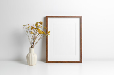 Wooden frame mockup in white minimalistic room with copy space for artwork, photo or print...