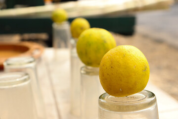 Row of Lemon on inverted glass at juice stall