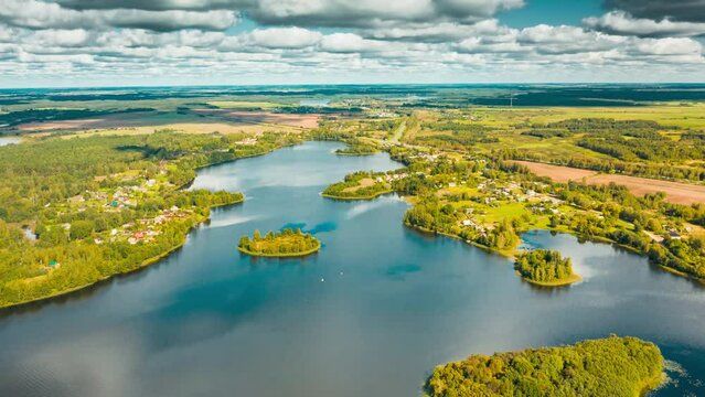 Hyperlapse Timelapse Dronelapse 4K Aerial View Of Villages Houses On Rivers Lakes Islands Summer Day. Top View Of Lake Nature From Attitude. Scenery Scenic Calm Landscape.