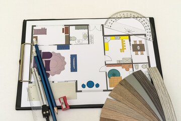 house blueprint with wooden vinyl sampler on desk