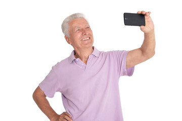 portrait of confident senior man taking selfie