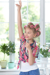 pretty girl with hair curlers with microphone