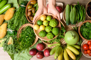 Organic Southeast Asian vegetables and fruits from local farmer market in summer season, Northern of Thailand, Sustainability concept, Table top view