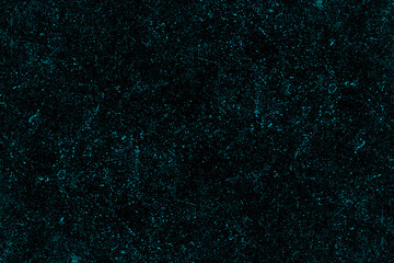 Scattered blue dots and dust particles on the black wall background for texture