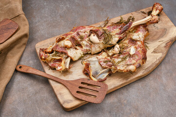 Roasted lamb shoulder with garlic, rosemary. Lamb meat, shoulder of mutton with spices. Lamb leg fillet ready to eat. Selective focus.