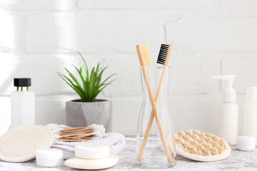Different eco-friendly bathroom accessories. Bamboo toothbrushes, ear sticks, facial sponges, soaps and various moisturizers. Zero waste concept