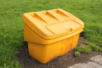 Road salt grit bin for Britain's next cold snap isolated with copy space - 495653013