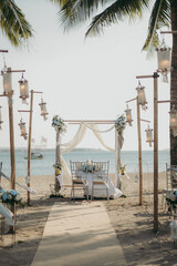 Vertical view of the wedding setup at the beach on a sunny day