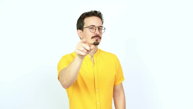 Man points finger at you with a confident expression over isolated background