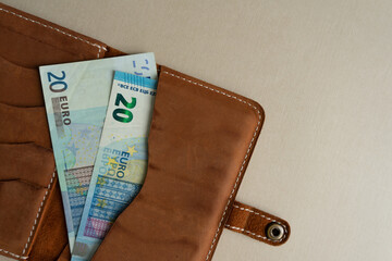 Money in the dockholder. Two banknotes of 20 euros in a wallet.