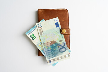 Money in the dockholder. Two banknotes of 20 euros in a wallet.