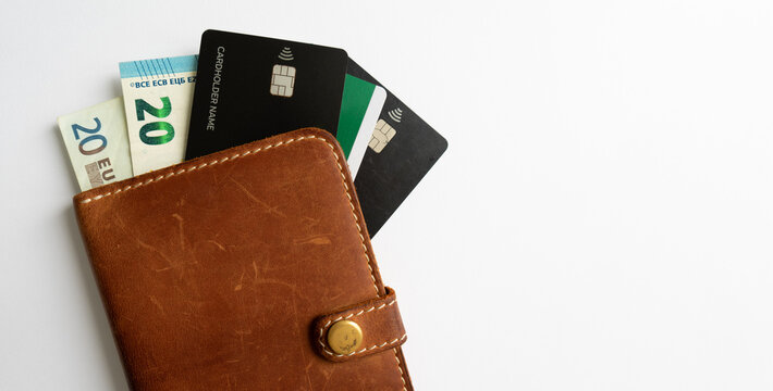 Money and credit cards in the dockholder.