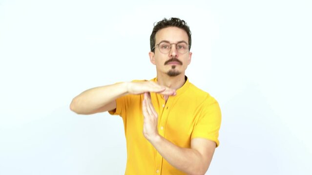 Man doing time out gesture over isolated background