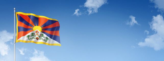 Tibetan flag isolated on a blue sky. Horizontal banner