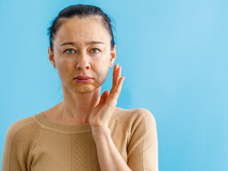Teeth Problem. Gumboil, flux, bruise and swelling of cheek. Closeup of Beautiful Sad Woman point...