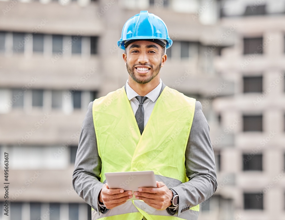 Poster building is my game. cropped portrait of a handsome young male engineer working on a tablet while st