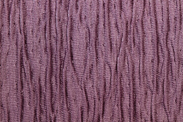 Textura fondo de tela morada con relieve y detalles. Vista de cerca. Macro