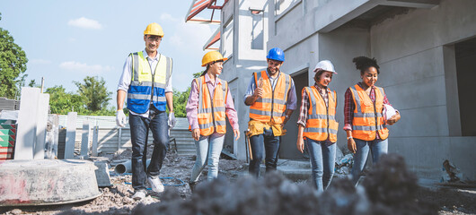Team architect and engineer walking and talking in work site.