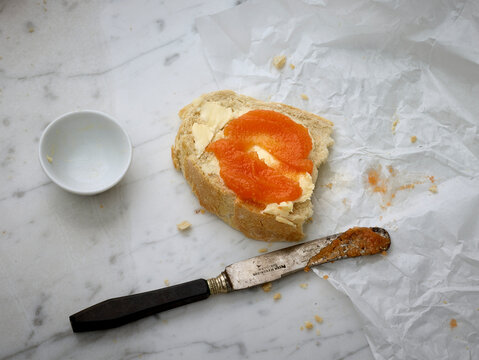 fresh bread with jam and knife