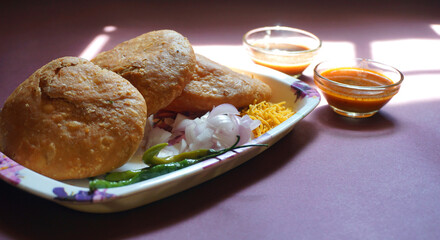 Kachori and samosa, Indian vegetarian snacks served with green and tamarind chutneys.