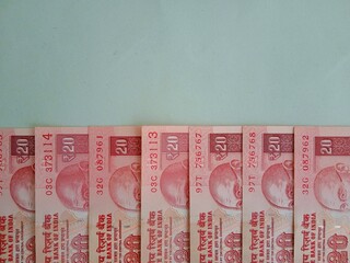 Stand out concept with twenty rupees notes series in which one is standing out. Braveness and...