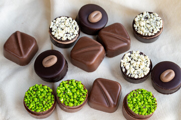 Assorted chocolates on a white background. assorted chocolate pralines. close up