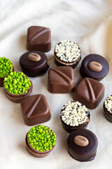 Assorted chocolates on a white background. assorted chocolate pralines. close up