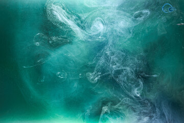 Green smoke on white ink background, colorful fog, abstract swirling emerald ocean sea, acrylic paint pigment underwater