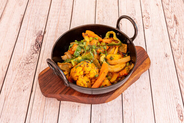 Vegetable jalfrezi is a popular Punjabi vegetable jalfrezi sabzi. vegetable jalfrezi features mixed vegetables cooked in a tomato base