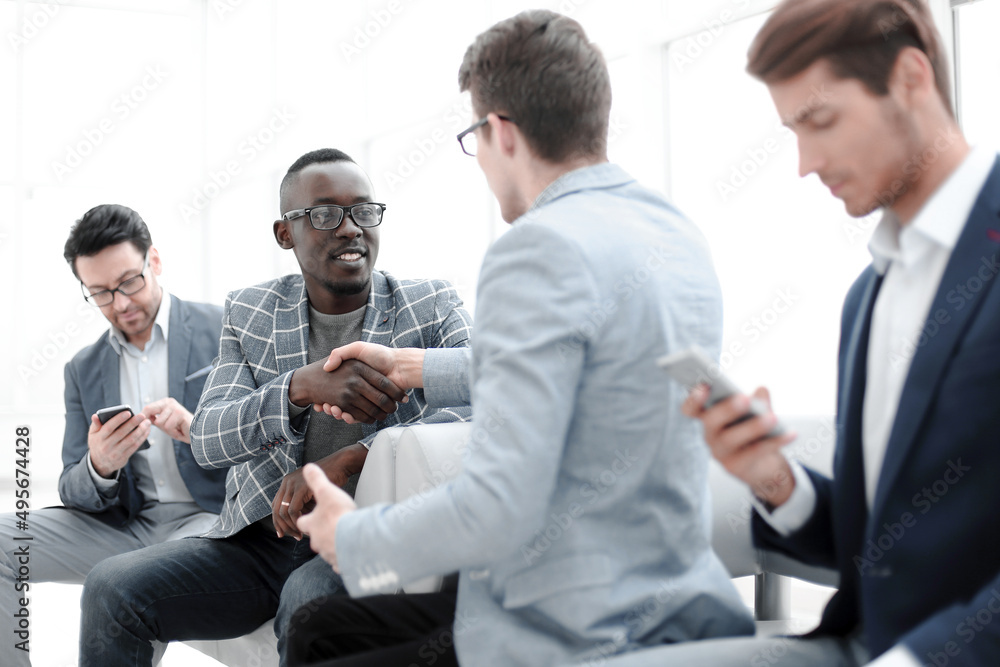 Wall mural handshake colleagues at a meeting in the office