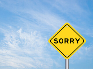 Yellow transportation sign with word sorry on blue color sky background