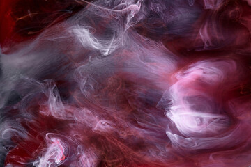 Black and red ink background, colorful fog, abstract swirling ocean, acrylic paint pigment underwater, white smoke