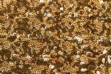 Textura fondo de lentejuelas doradas. Vista de cerca