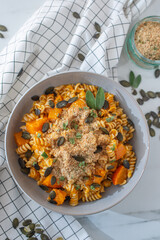 pasta alla zucca, healthy home made pumpkin pasta on a table