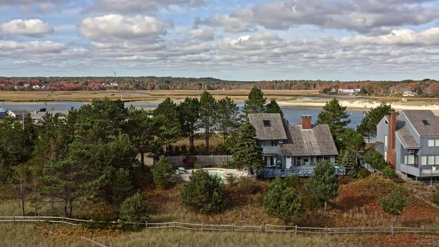 Wells Maine Aerial v1 beautiful landscape shot, drone fly around wells harbor capturing the sea wall, drakes island beach and seaside holiday homes at daytime - October 2020