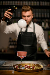 beautiful view of bubble with smoke above glass with cocktail on tray