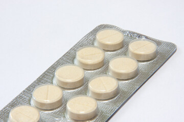 medicinal pills and capsules in blisters close-up. macro shooting of multicolored pills of different sizes