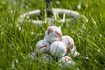 Closeup shot of Golf balls found on the field while detecting