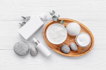 Flatlay of thite tube and bottle for cosmetic products, top view