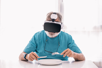 Man with dishware exploring virtual reality