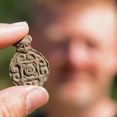 Closeup shot of Viking Age brooch in bronze in Denmark