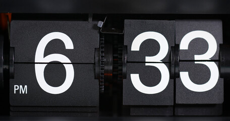 Flip Clock Showing at 06:33 p.m. Spinning on black background.