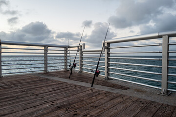 fishing rods on a pier