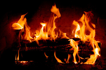 Burning fireplace, wood logs, cozy warm home